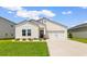 Charming home with manicured lawn, beautiful flowerbed and a driveway leading to a one car garage at 1029 Saltgrass Way, Myrtle Beach, SC 29588
