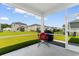 Relaxing screened-in porch with seating and a barbecue grill at 1029 Saltgrass Way, Myrtle Beach, SC 29588