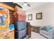 Organized storage room with shelves, bins, and a comfortable chair at 1029 Saltgrass Way, Myrtle Beach, SC 29588