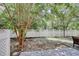 A backyard with pavers, a fence and a mix of grass and exposed dirt at 105 Spring Creek Dr. # C, Myrtle Beach, SC 29588