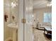 Bright bathroom features a pedestal sink, neutral paint, and modern lighting at 105 Spring Creek Dr. # C, Myrtle Beach, SC 29588