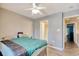 Bedroom with a ceiling fan and doorway to an ensuite bathroom at 105 Spring Creek Dr. # C, Myrtle Beach, SC 29588