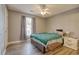 Bedroom featuring wood-look floors, a ceiling fan and a window with curtains at 105 Spring Creek Dr. # C, Myrtle Beach, SC 29588