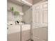 Compact laundry room with a washer and dryer unit with a wire shelf at 105 Spring Creek Dr. # C, Myrtle Beach, SC 29588