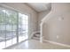 Cozy living area with sliding glass door to the exterior and staircase at 105 Spring Creek Dr. # C, Myrtle Beach, SC 29588