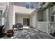 The outdoor patio features a gray paver surface, furniture, a sliding glass door, and a storage closet at 105 Spring Creek Dr. # C, Myrtle Beach, SC 29588