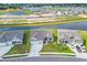Panoramic aerial shot of a residential neighborhood with ponds nearby and some construction, showcasing community layout at 1121 Oxeye St., North Myrtle Beach, SC 29582