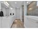 Modern bathroom featuring double sinks, a walk-in shower, and contemporary fixtures at 1121 Oxeye St., North Myrtle Beach, SC 29582
