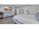 Well-lit bedroom featuring modern furniture, decor, and ensuite access at 1121 Oxeye St., North Myrtle Beach, SC 29582