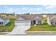 Exterior shot of the home featuring a manicured lawn, a two car garage and a welcoming front entrance at 1121 Oxeye St., North Myrtle Beach, SC 29582