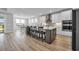 Modern kitchen featuring a center island with bar seating, stainless steel appliances, and ample cabinet space at 1121 Oxeye St., North Myrtle Beach, SC 29582