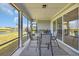 Screened-in patio with outdoor seating overlooking pond and backyard at 1121 Oxeye St., North Myrtle Beach, SC 29582