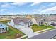 Street view of homes with well-manicured lawns and driveways in a planned community, adding to curb appeal at 1121 Oxeye St., North Myrtle Beach, SC 29582