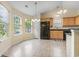 Bright kitchen and dining area with natural light, stainless steel appliances, and ample cabinet space at 1133 Spalding Ct., Surfside Beach, SC 29575