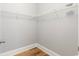 Well-organized walk-in closet featuring white wire shelving and wood flooring at 118 Birch N Coppice Dr. # 2, Surfside Beach, SC 29575