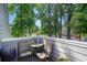 Cozy balcony seating area with wooded views creating a tranquil, peaceful setting at 1205 Erin Way # 5C, Myrtle Beach, SC 29577