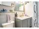 Stylish bathroom with stacked washer and dryer, sleek vanity, and decorative accents for modern appeal at 1205 Erin Way # 5C, Myrtle Beach, SC 29577
