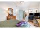 Bright bedroom featuring hardwood floors, a ceiling fan, and a wooden dresser with decorative mirror at 1205 Erin Way # 5C, Myrtle Beach, SC 29577