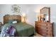 Cozy bedroom with a unique bamboo headboard, a woven dresser, and neutral wall color at 1205 Erin Way # 5C, Myrtle Beach, SC 29577