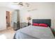 Upstairs bedroom with hardwood floors, a ceiling fan, bed, and private en-suite bathroom with shower at 1205 Erin Way # 5C, Myrtle Beach, SC 29577
