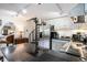Modern kitchen with stainless steel appliances, granite countertops, white cabinets and a spiral staircase nearby at 1205 Erin Way # 5C, Myrtle Beach, SC 29577