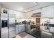 Well-equipped kitchen with stainless steel appliances, light countertops, white cabinets, and a tiled backsplash at 1205 Erin Way # 5C, Myrtle Beach, SC 29577