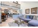 Open-concept living room featuring a modern kitchen, a lofted area, and comfortable seating with stylish decor at 1205 Erin Way # 5C, Myrtle Beach, SC 29577
