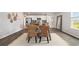 Elegant dining area with a wooden table, stylish chairs, and plenty of natural light at 125 Dagger Ct., Myrtle Beach, SC 29588