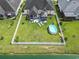 Aerial view of the backyard featuring an above ground pool, pergola, patio, fenced yard, and green space at 131 River Country Dr., Conway, SC 29526