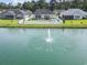 Aerial view showcases the property's backyard with a pool, and access to the community pond at 131 River Country Dr., Conway, SC 29526