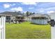 Expansive backyard featuring a patio, outdoor bar, an above-ground pool, and lush green grass at 131 River Country Dr., Conway, SC 29526