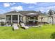 Backyard oasis featuring a screened-in patio, outdoor bar, and lounge chairs at 131 River Country Dr., Conway, SC 29526