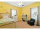 Comfortable bedroom with bright yellow walls, coastal decor, and ample natural light at 131 River Country Dr., Conway, SC 29526