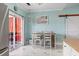 Charming dining area with sliding glass doors to the patio and a barn door detail on the side at 131 River Country Dr., Conway, SC 29526