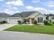 Charming single-story home with a two-car garage, manicured lawn, landscaping, and inviting curb appeal at 131 River Country Dr., Conway, SC 29526