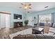 Comfortable living room with a large window, plush seating, and a stylish coffee table on a decorative rug at 131 River Country Dr., Conway, SC 29526