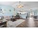 Bright living room showcasing an open concept design with dining area and kitchen in background at 131 River Country Dr., Conway, SC 29526