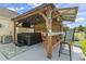 Outdoor bar area with a hot tub, seating, and rustic wood finishes, perfect for entertaining at 131 River Country Dr., Conway, SC 29526