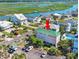 An aerial view displays the home near a picturesque marsh, with its lush greenery and waterfront access at 1473 Basin Trail, Murrells Inlet, SC 29576