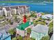This aerial shot displays the home's roof and surrounding landscaping near water, showcasing its location at 1473 Basin Trail, Murrells Inlet, SC 29576