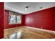 Bright bedroom featuring hardwood floors and a large window, with decorative wallpaper at 1473 Basin Trail, Murrells Inlet, SC 29576