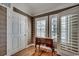 This hallway features wood floors, neutral walls, doors with windows, and a small table with decorative accents at 1473 Basin Trail, Murrells Inlet, SC 29576