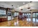 Expansive living area featuring hardwood floors, elegant lighting, and a wine fridge for entertaining guests at 1473 Basin Trail, Murrells Inlet, SC 29576