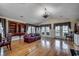 Bright living space featuring hardwood floors, elegant furnishings, and large windows offering serene outdoor views at 1473 Basin Trail, Murrells Inlet, SC 29576