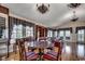 Bright living area with hardwood floors, elegant lighting, a dining table, and stylish decor elements at 1473 Basin Trail, Murrells Inlet, SC 29576