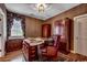 This office features custom wood cabinetry, a decorative ceiling light and an executive desk with a leather chair at 1473 Basin Trail, Murrells Inlet, SC 29576