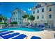 Outdoor pool with lounge chairs and white fence offering a relaxing community space on a sunny day at 1473 Basin Trail, Murrells Inlet, SC 29576
