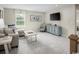Relaxing sitting area with neutral walls, a comfy sofa, a window, and stylish furnishings at 1664 Hope Pointe Dr, North Myrtle Beach, SC 29582