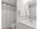 A clean bathroom featuring white fixtures, a shower with curtain and a vanity sink at 180 Rothbury Circle # 305, Myrtle Beach, SC 29572