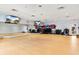 Bright exercise room with mirrored wall, equipment, and mounted televisions at 180 Rothbury Circle # 305, Myrtle Beach, SC 29572